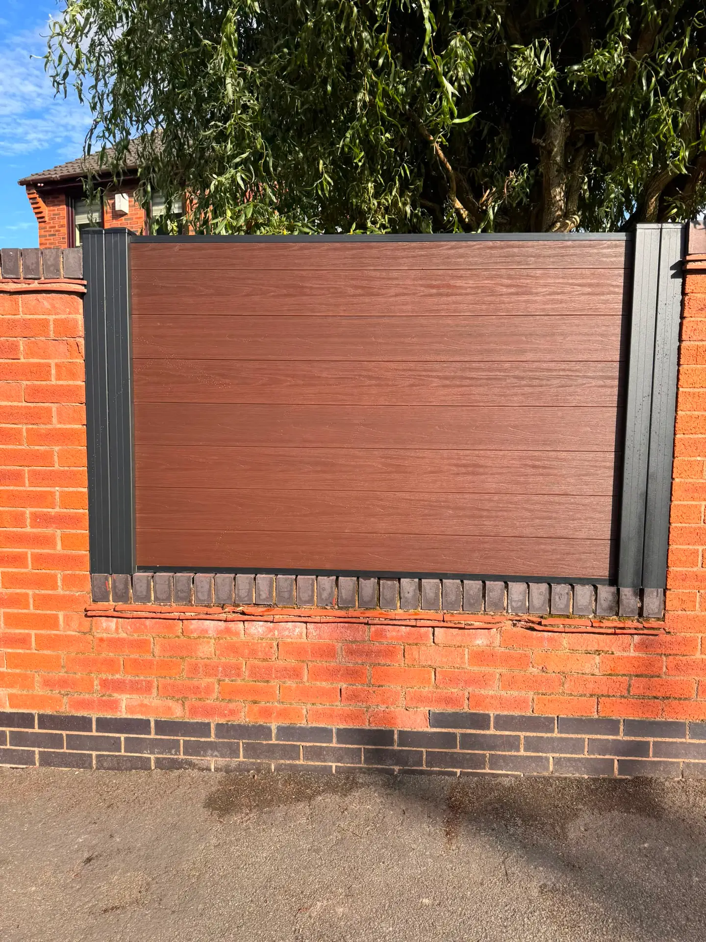 Composite Fences Liverpool composite fencing mounted on brick wall.jpg
