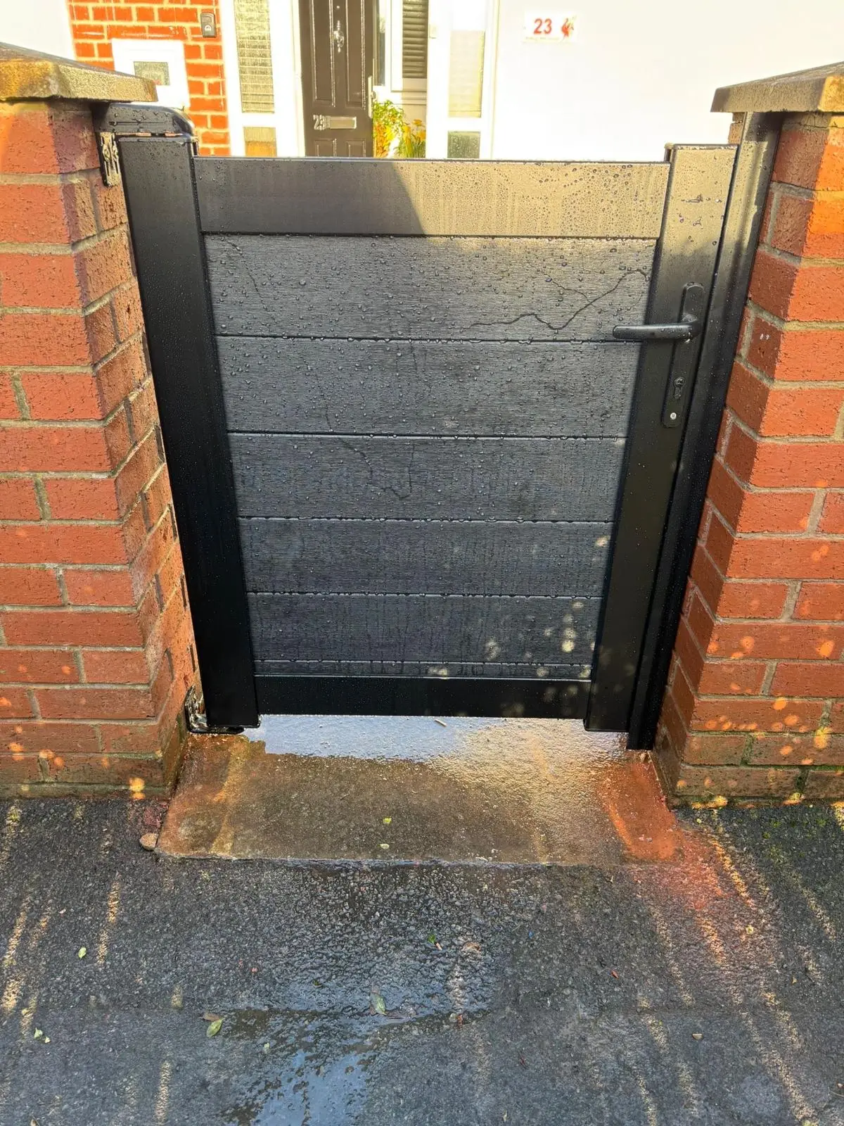 Weatherboard Fencing modern grey composite driveway gate.jpg